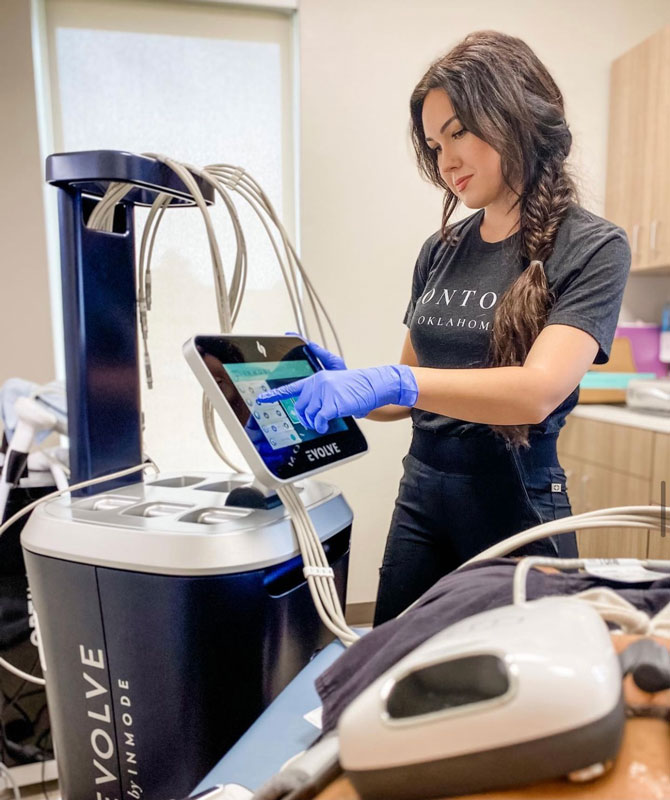RN at Contour Oklahoma in Edmond shows Evolve skin care machinery.